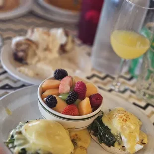 egg Benedict with sub fruit