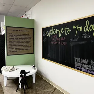 a blackboard and a white table