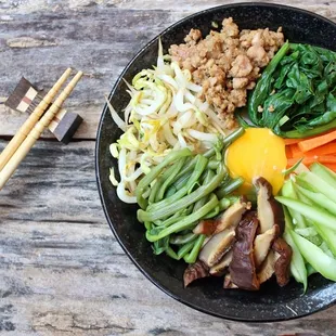Traditional Korean dish - Bibimbap assorted vegetables, meat, &amp; rice in a hot stone bowl! #SeoulGalbi #KoreanBBQ #AllMeats #HighQuality #T