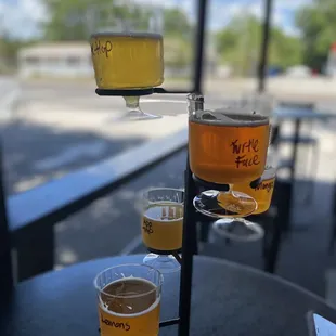 four glasses of beer on a table