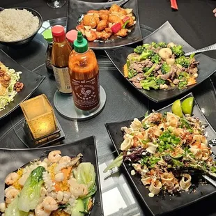 a table with a variety of asian food