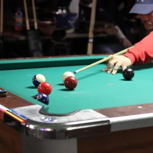 a man playing pool