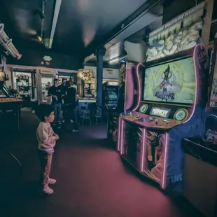 a little girl playing a video game