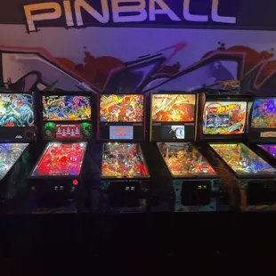 a row of pinball machines