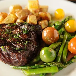 Today&apos;s butcher selection of Angus beef grilled to order, finished with herb butter. Served with sautéed seasonal vegetables.