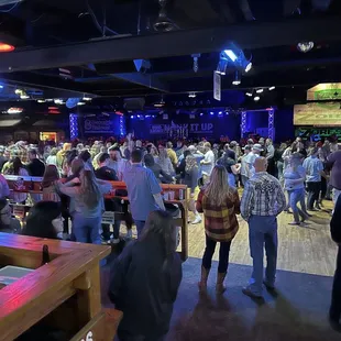 a crowd of people at a bar