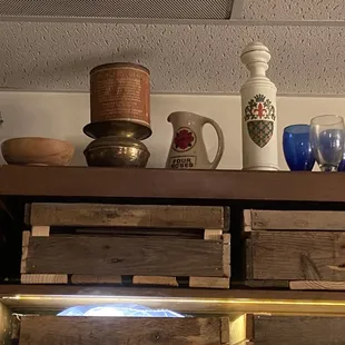 a shelf of antique items