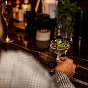 a woman holding a glass of wine