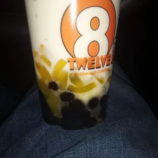 Peach smoothie with mango strips and boba