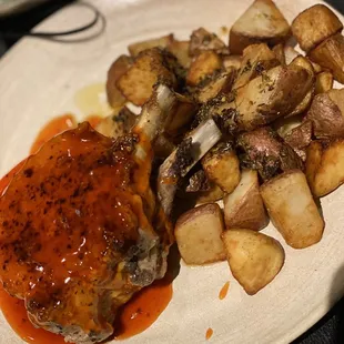Delicious Double boned tender Pork Chops with blueberry, strawberry and orange marmalade plus potatoes.