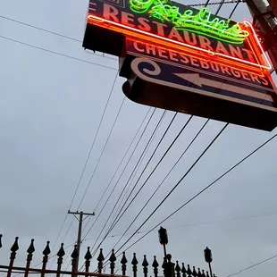 the neon sign for the restaurant