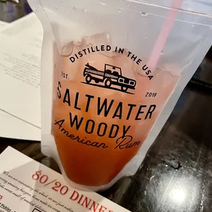 a drink in a plastic bag