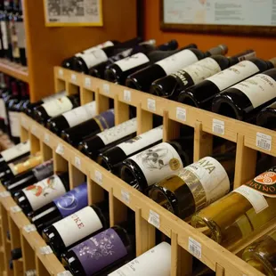 a shelf of wine bottles