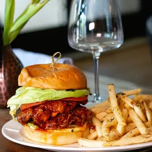 a plate of food and a glass of wine