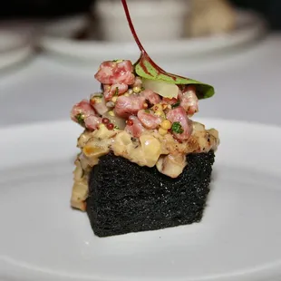 The second small plate was Squid Ink Milk Bread toasted in Hokkaido A5 Snow Beef fat and topped with Red Veined Sorrel Microgreens.