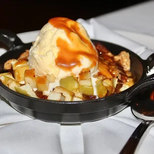 The Apple Crumble was served with vanilla ice cream.