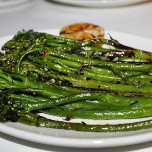 The Grilled Broccolini was seasoned with Garlic Butter, Chili Flake, &amp; Grilled Lemon.