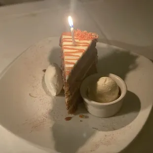 Carrot cake with whipped cream and ice cream