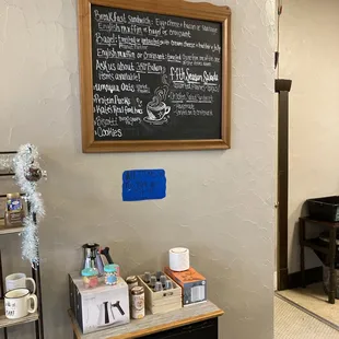 a coffee shop with a chalkboard on the wall