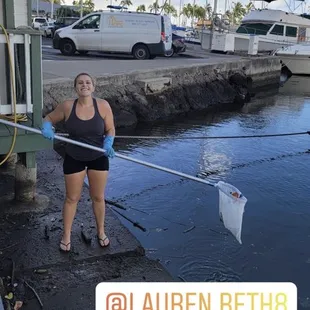 Fishing the trash out of the ala wai harbor