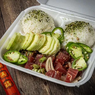 Hawaiian-style tuna poke bowl with cucumbers and jalapeños - $16.25 take-out