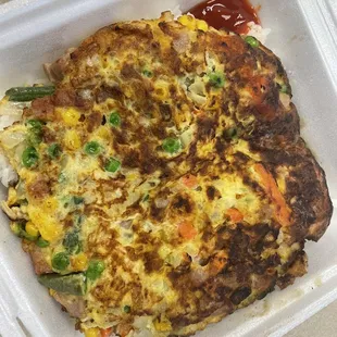 a meal in a styrofoam container