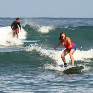 Coach and student on back to back waves