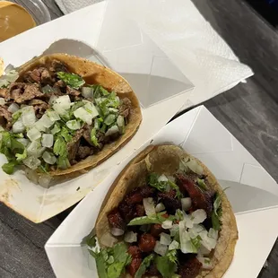 two tacoss on a table