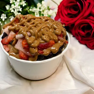 A loaded açaí bowl smothered with cookie butter