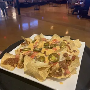 We offer Nachos, wings, pizza, burgers, philly's and other handhelds from our made from scratch kitchen.