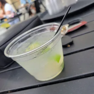 a drink in a plastic cup on a table
