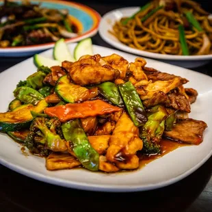 a plate of chicken and vegetables