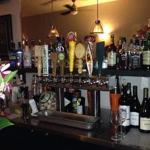 a bar filled with bottles of alcohol