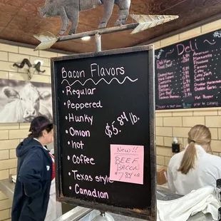a pig on top of a sign