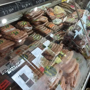 a variety of donuts in a display case