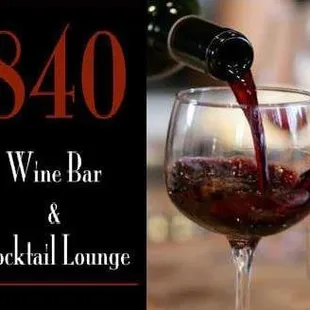 a glass of wine being poured
