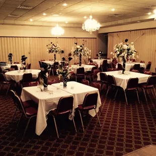a banquet room with tables and chairs