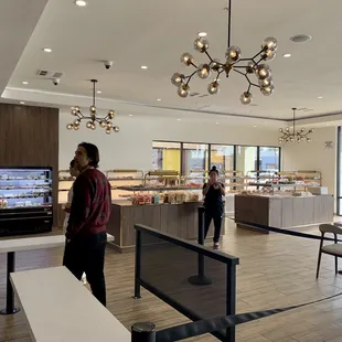  two people standing in front of the counter
