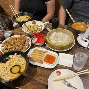 Tonkotsu Ramen, wonton in chili oil, xiaolong bao, lumpia, and chow main