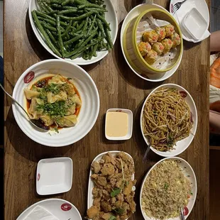 Green beans, shrimp and pork shumai, wontons in chili oil, vegetable chow mein, popcorn chicken, egg fried rice