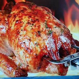 a roasting chicken on a fork
