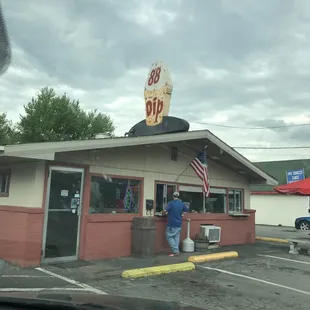 a man standing in front of a diner