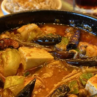 Spicy sliced fish in a clay pot.