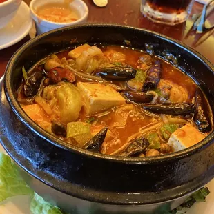 Spicy sliced fish in a clay pot.