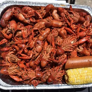Crawfish bowl with sausage and corn