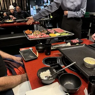 Server explaining everything we ordered