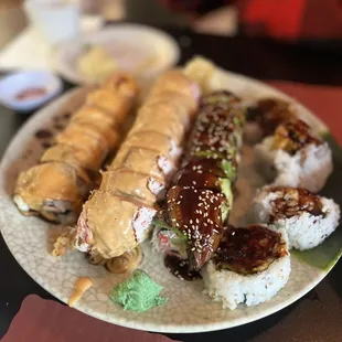 Shrimp tempura, salmon and whitefish roll, dragon roll, soft shell crab.