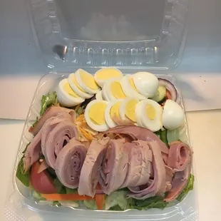 a salad in a plastic container