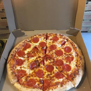 a pepperoni pizza in a box