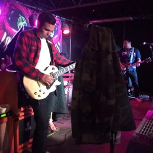 a man playing a guitar